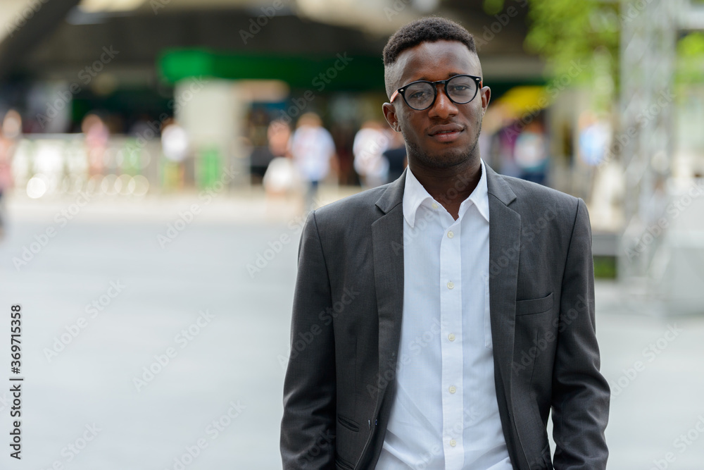 Young African businessman in the city outdoors Young African businessman in the city outdoors