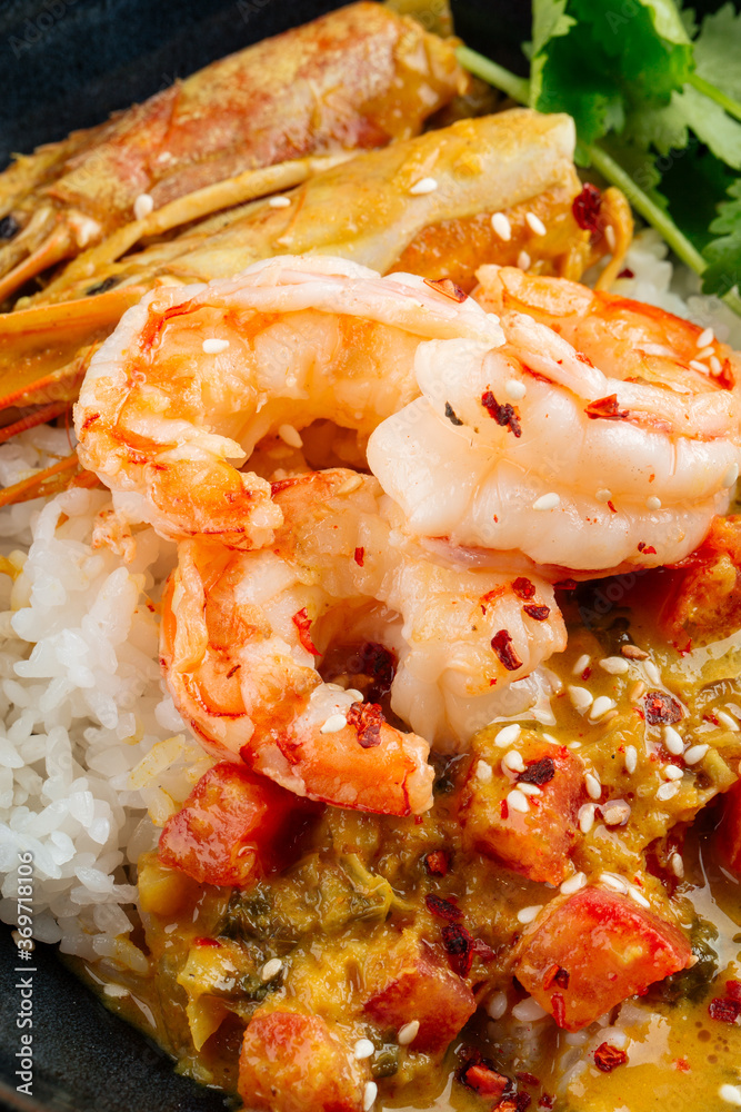 Asian dish curry with langoustines and hikari rice Asian dish curry with langoustines and hikari rice