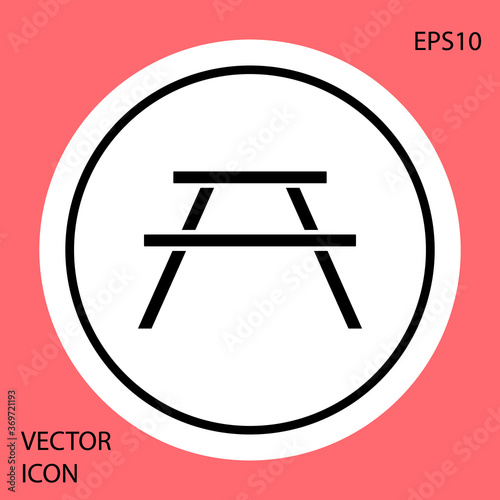 Black Picnic table with benches on either side of the table icon isolated on red background. White circle button. Vector Illustration.