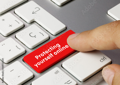 Protecting yourself online - Inscription on Red Keyboard Key.