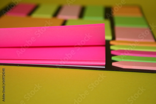 set of colorful stickers for notes on a yellow background