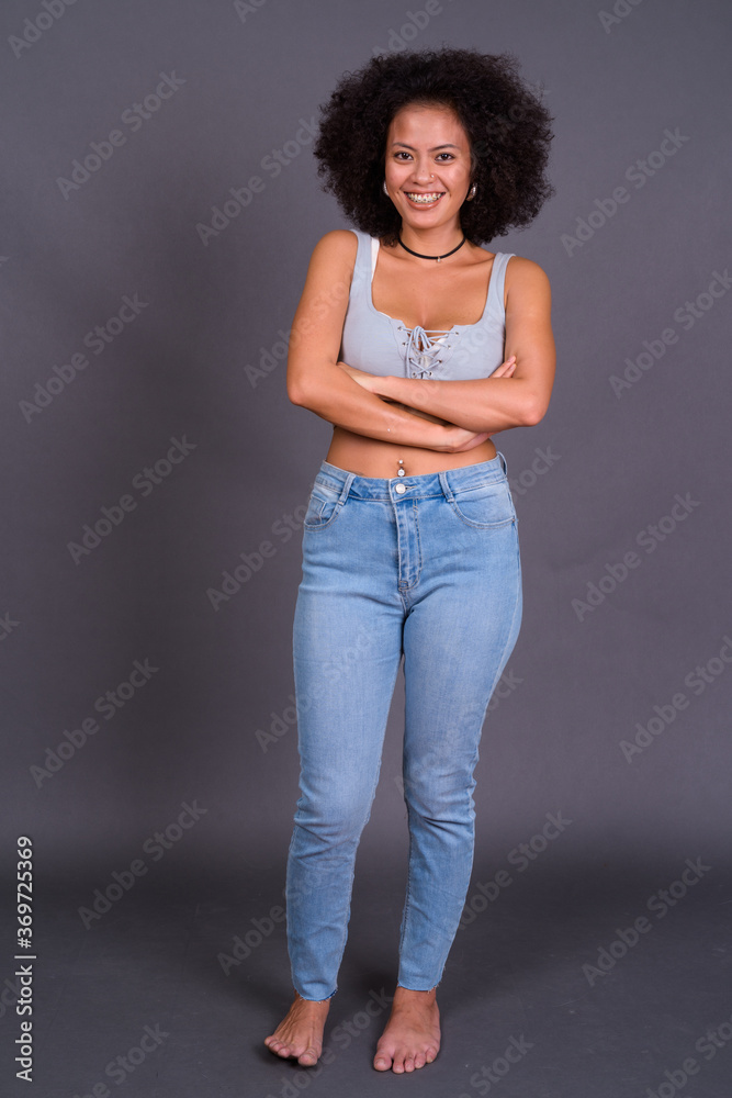 Happy young beautiful African woman with Afro hair Happy young beautiful African woman with Afro hair