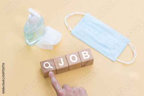 Businessman hand arranging wood block stacking with search job icon. Job search during coronavirus pandemic, health security concept.