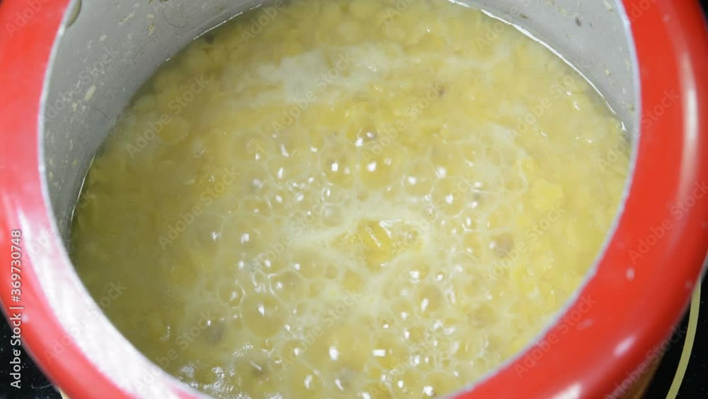 Cooking split pigeon peas in a pressure cooker. They are also called as