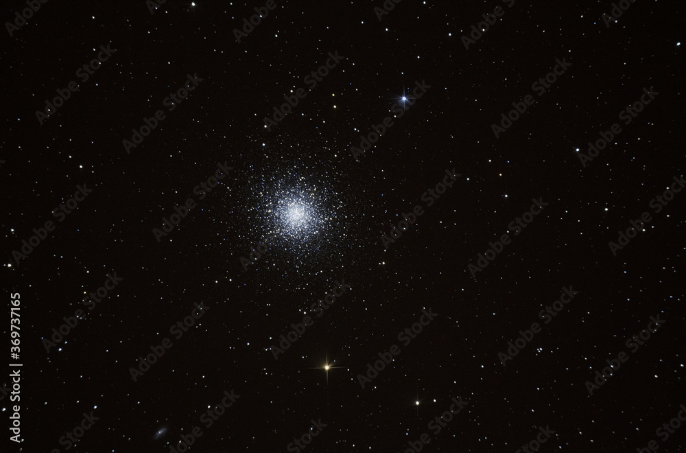Fototapeta premium Telescope view of a globular star cluster containing a multitude of stars