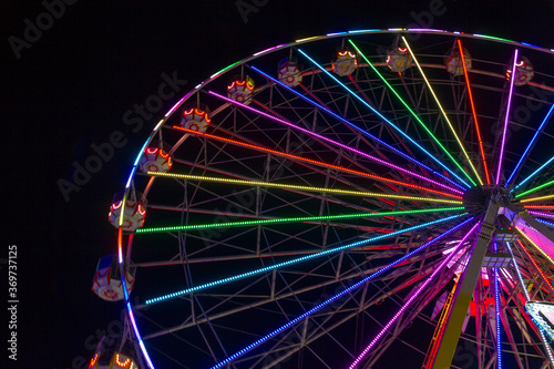 ferris wheel at night and rainbow colors