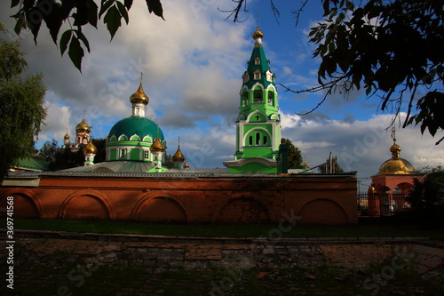 green church with golden domes