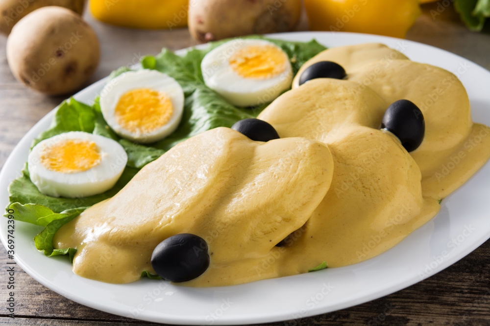 Traditional Peruvian papa a la huancaina on gray background	