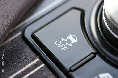 Fotografie Close up of vehicle traction control button