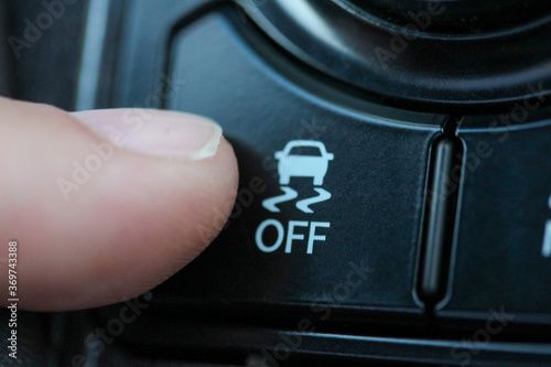 Fotografie Finger on traction control button