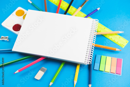 School supplies on a blue background.