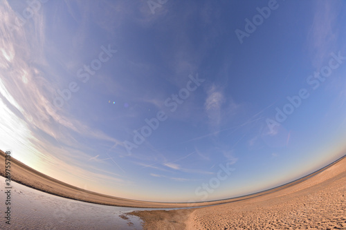 Distorted sea at low tide on a sunny day.