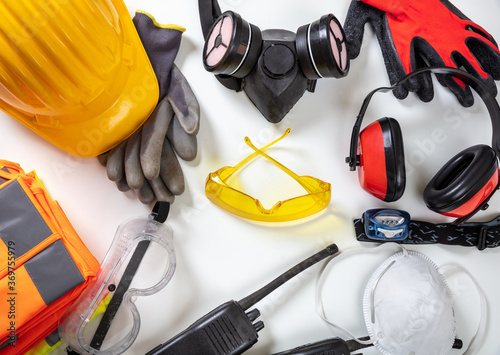 Work safety protection equipment background. Industrial protective gear on white photo