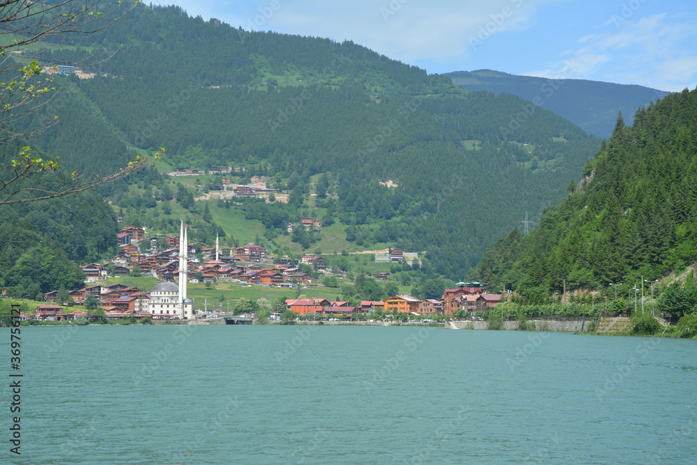 Lake with a village in the background.