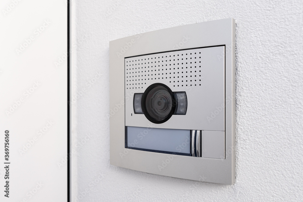 Video camera intercom in the entry of a building or house. Security system Video camera intercom in the entry of a building or house. Security system