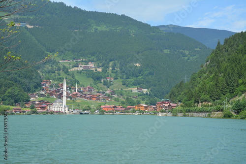 Lake with a village in the background. © şakir