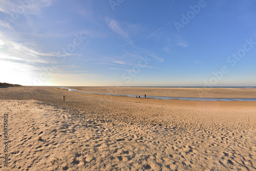 The beach and the sea coast on a sunny day in the fisheye lens.