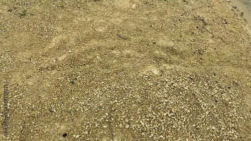 Old abandoned sand pit on a summer cloudy day photo