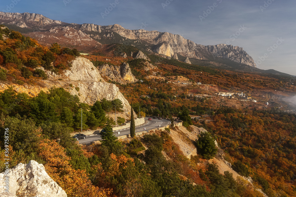 Scenic road in the mountains in autumn. Very beautiful colorful autumn landscape with mountain serpentine. Crimea, Simeiz, Yalta.