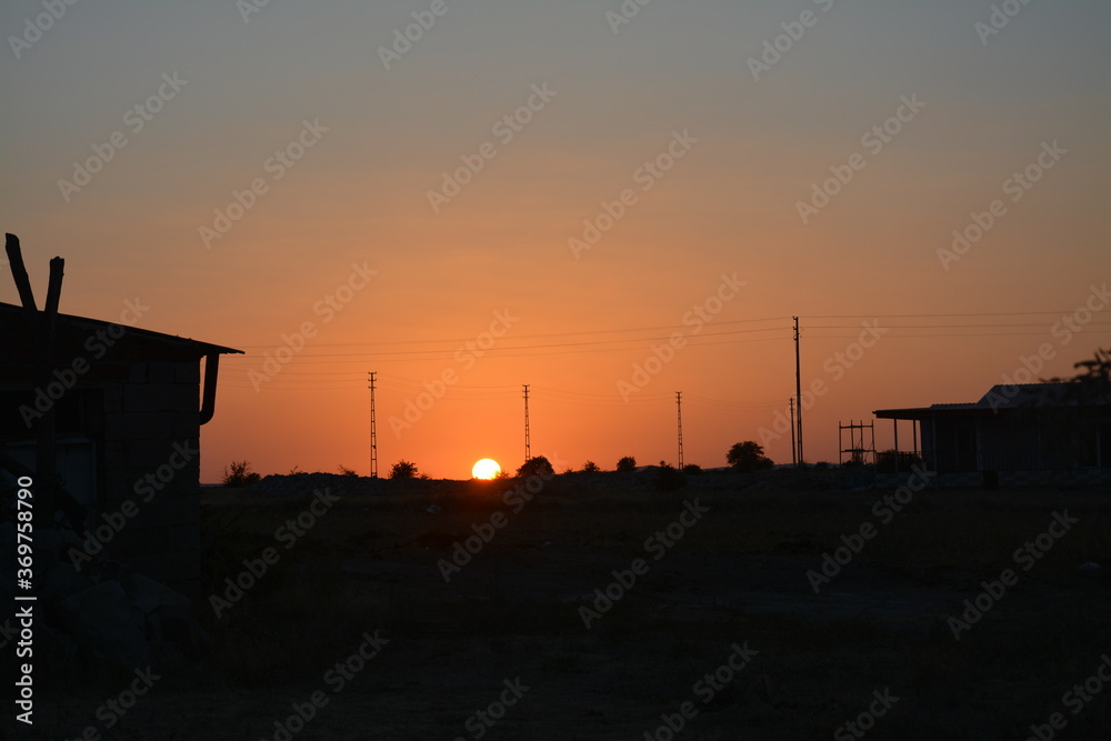 Obraz premium Sunset at village.