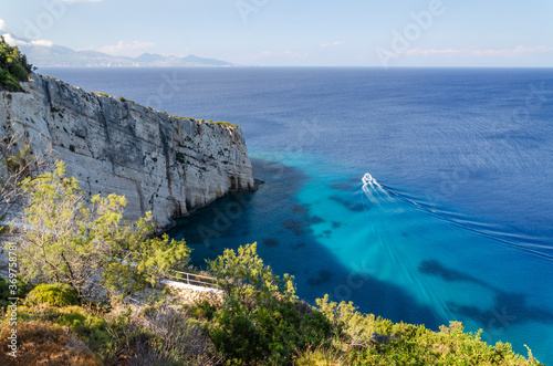 Picturesque view on turquoise Careta Trampolino rocky beach. It is situated on the north east coast of Zakynthos island on Ionian Sea, Greece.