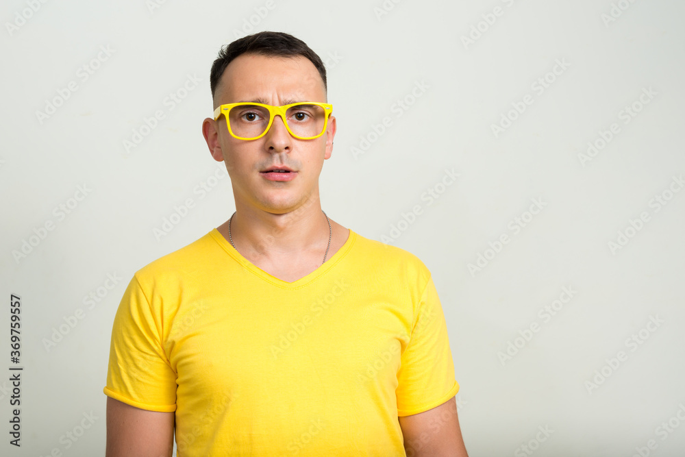 Portrait of handsome man with yellow shirt