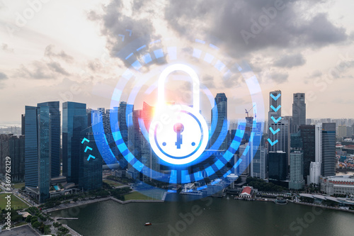 Hologram of Padlock on sunset panoramic cityscape of Singapore, Asia. The concept of cyber security intelligence. Multi exposure.