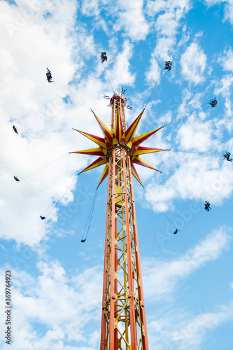 Kouvola, Finland - 14 July 2020: Ride Star Flyer in motion in amusement park Tykkimaki at summer sunny day