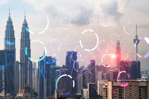 Canvas Print Abstract technology icons hologram over panorama city view of Kuala Lumpur, Malaysia, Asia
