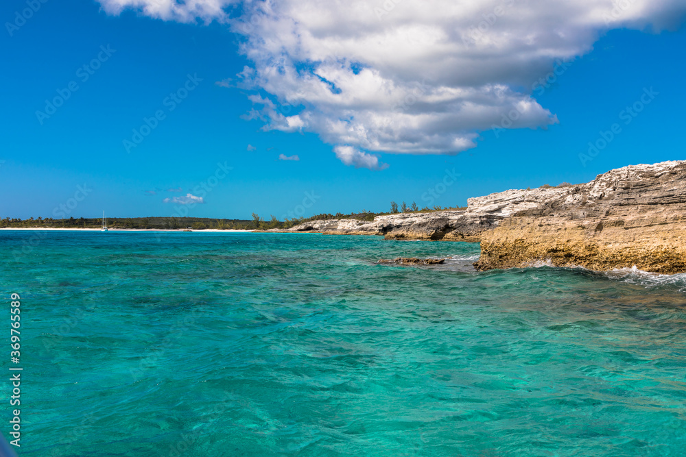 The blue skies and turquoise waters of the Caribbean island of Eleuthera, Bahamas The blue skies and turquoise waters of the Caribbean island of Eleuthera, Bahamas