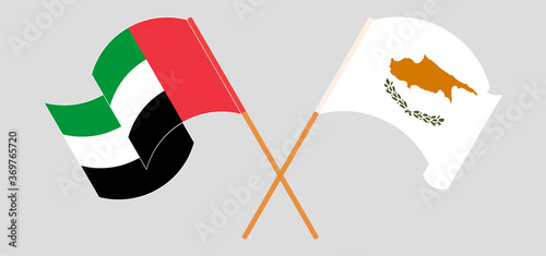 Crossed and waving flags of Cyprus and the United Arab Emirates