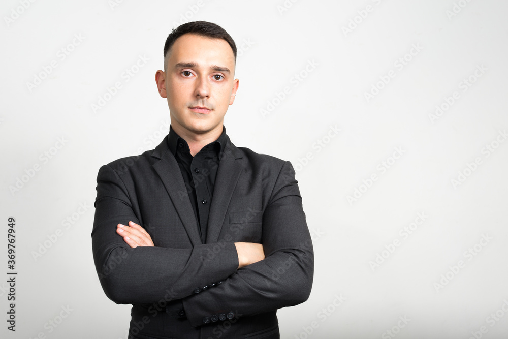 Portrait of handsome businessman in suit against white background Portrait of handsome businessman in suit against white background