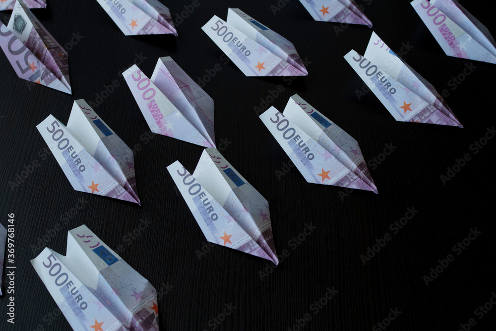Paper airplanes made of Euro banknotes, the concept of cash flow. Paper airplanes made of Euro banknotes, the concept of cash flow.