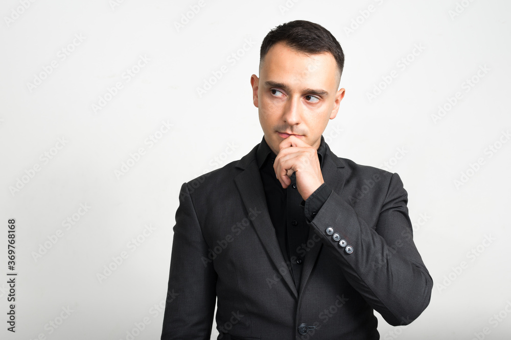 Portrait of handsome businessman in suit against white background Portrait of handsome businessman in suit against white background