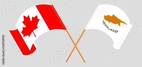 Crossed and waving flags of Cyprus and Canada