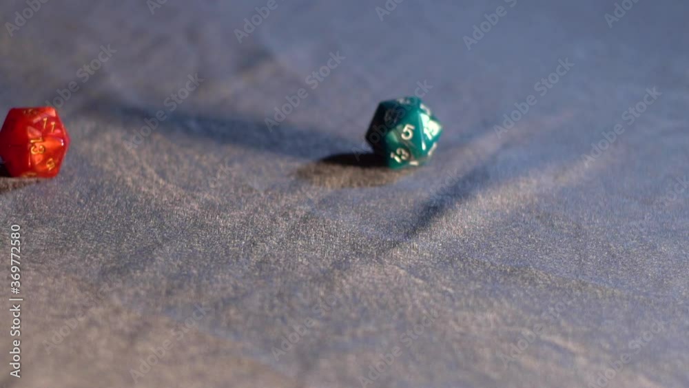 Three dice rolling on fabric, slow motion Three dice rolling on fabric, slow motion