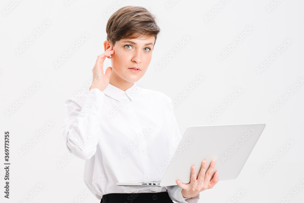 Portrait of a businesswoman using laptop on the office chair isolated on a white background Portrait of a businesswoman using laptop on the office chair isolated on a white background