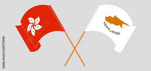 Crossed and waving flags of Cyprus and Hong Kong