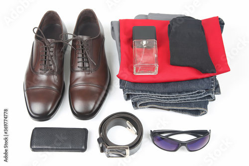 Classic men's shoes, belt, glasses, eau de toilette, clothes and mobile phone on white background