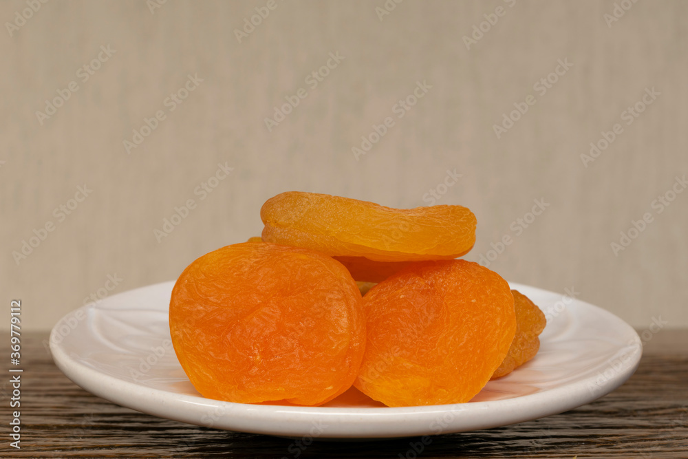 dried apricots in white dish dried apricots in white dish