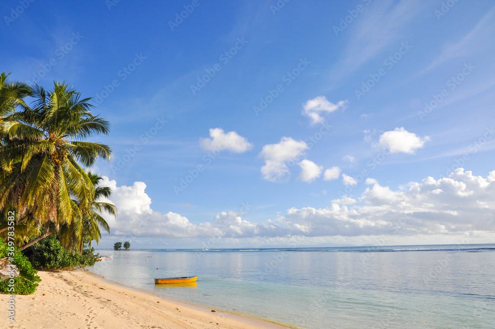 Tropical seascape with yellow small local boat horizon over the water and blue sky