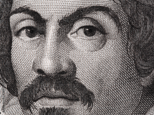 Caravaggio portrait on 100000 italian lire banknote closeup macro. One of the greatest and innovative painter of the Renaissance. photo