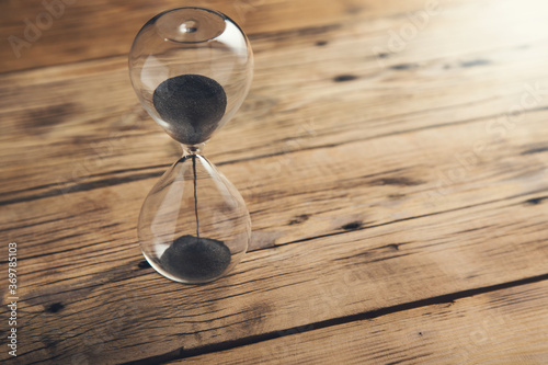 hourglass on the wooden table