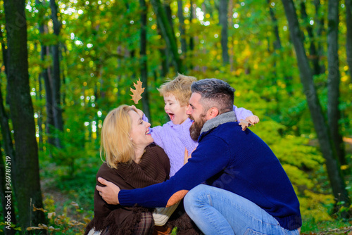 Happy family. Happy young couple with kid outdoors. Family with boy. Young parents and children having picnic and relaxing together on an autumns sunny day. Happy family outdoors. © Svitlana