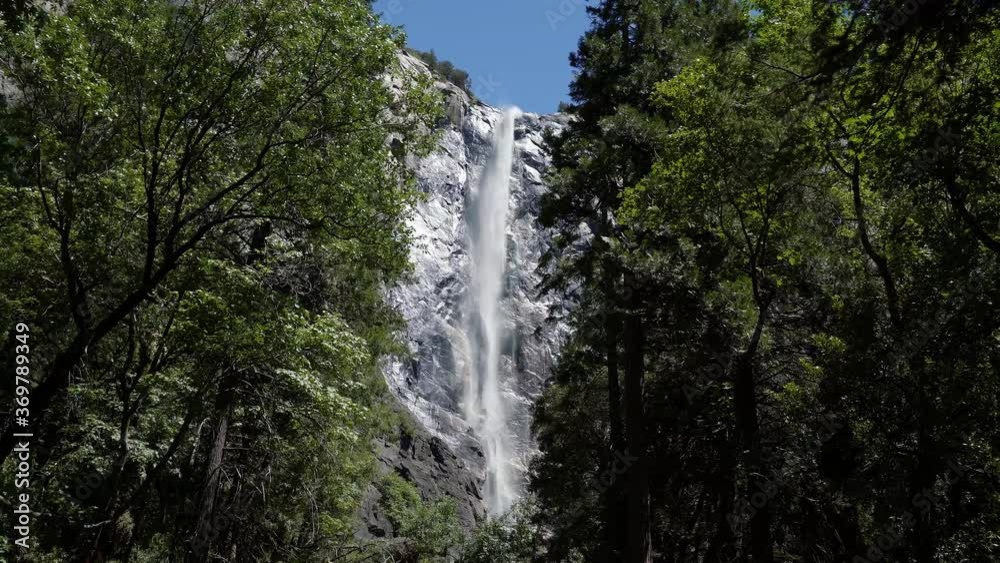 Beautiful slow motion shot of the famous Bridalveil Fall waterfall in Yosemite on a warm sunny summer day in California. Beautiful slow motion shot of the famous Bridalveil Fall waterfall in Yosemite on a warm sunny summer day in California.