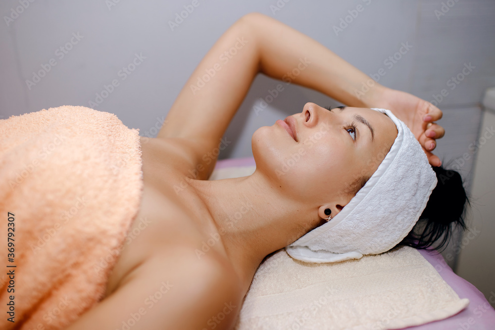 young girl in the spa getting ready for cosmetic procedures