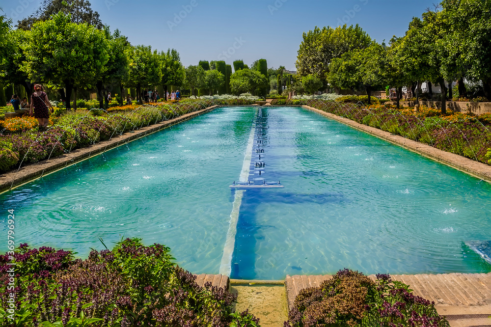 Ornamental pools and gardens in Cordoba, Spain in the summertime