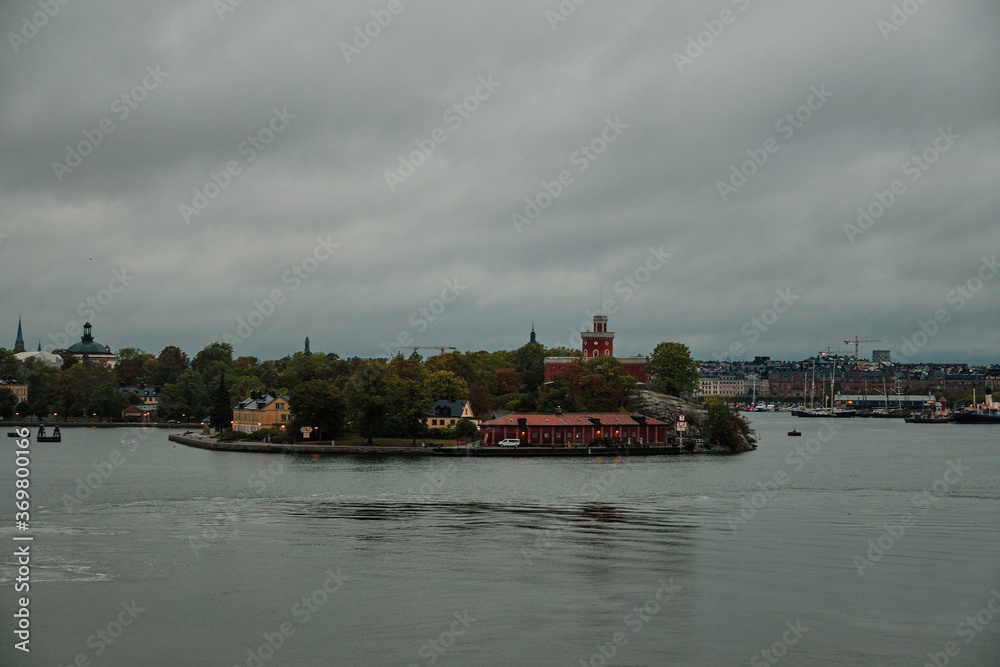 Naklejka premium Sweden. Stockholm. Stockholm coast early in the morning. Lights of the morning city. September 17, 2018