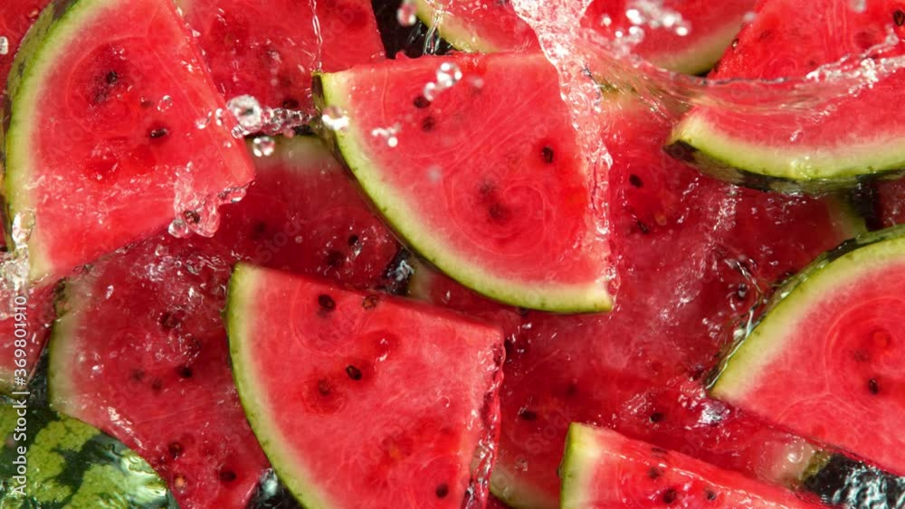 Super Slow Motion Shot of Splashing Water on Fresh Watermelon Slices at 1000fps. Super Slow Motion Shot of Splashing Water on Fresh Watermelon Slices at 1000fps.