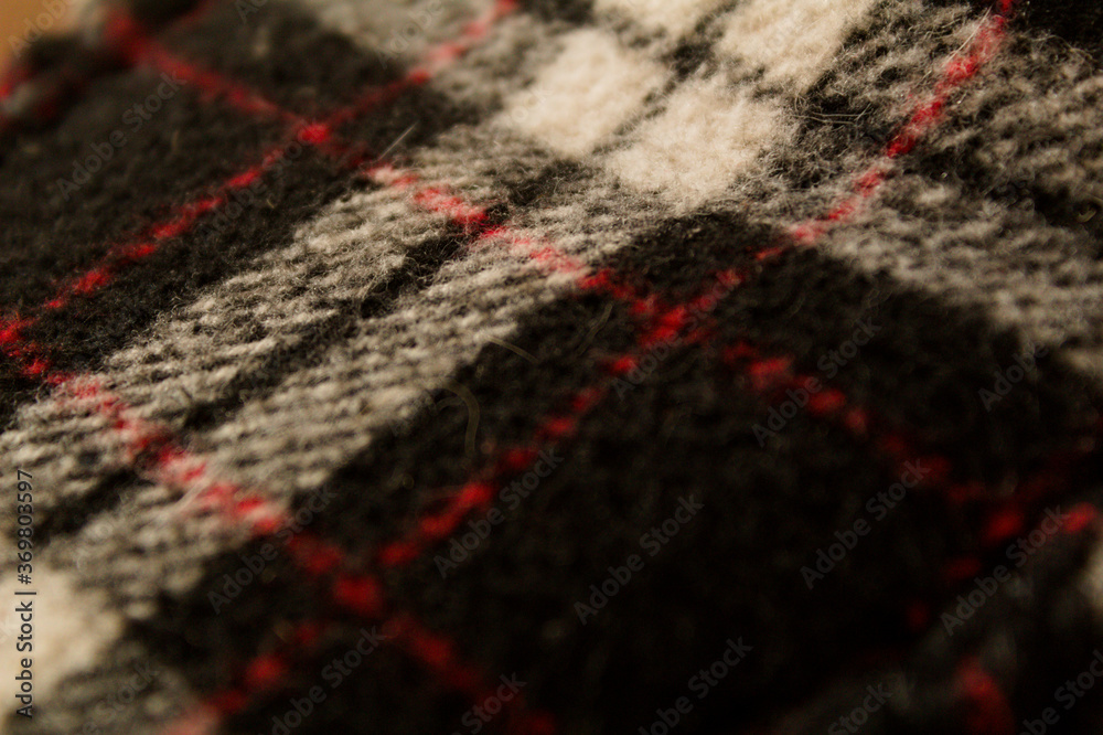 Fototapeta premium knitted wool slippers tartan pattern checked